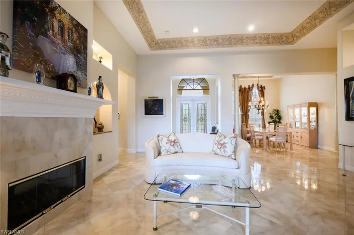 Formal Living Room with trey ceiling and open to the Formal Dining Room