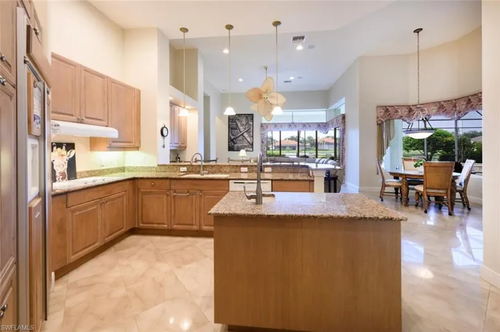Well designed Kitchen with a large island  and plenty of cabinet storage