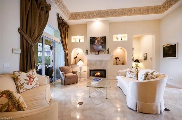 Formal living room with built in fireplace