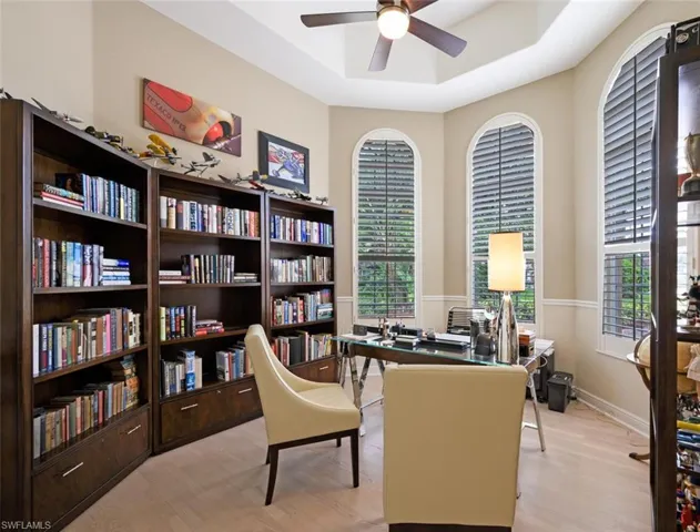 Home office with Built in Bookcases and large Arched Windows for lots of natural light