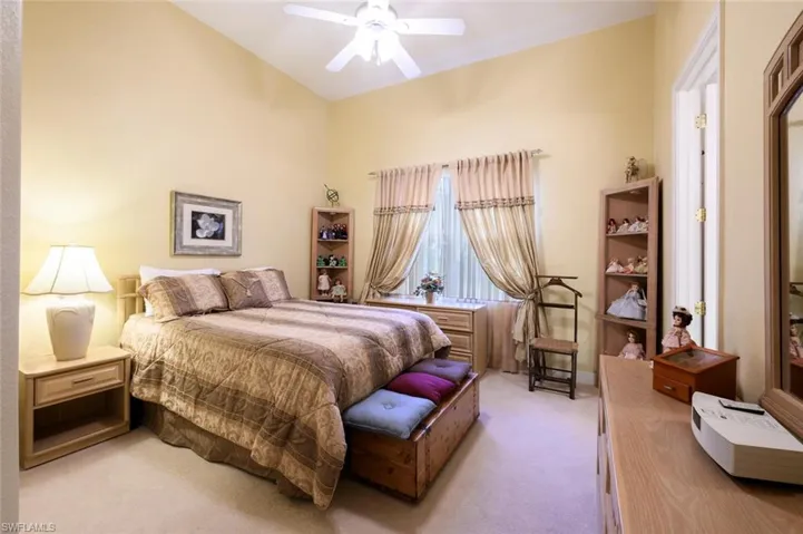 Guest Bedroom with carpet and Walk in Organized Closet