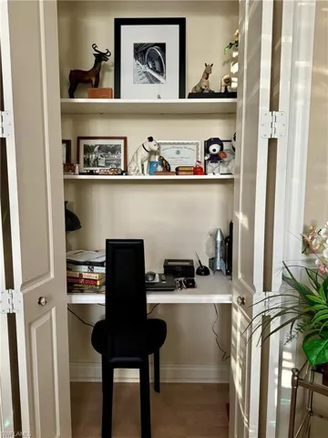 Built in desk and shelving in the office closet for additional work space