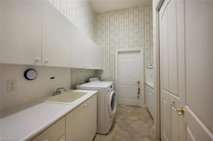 Laundry room with great Cabinet Storage and Pantry Space with access to the 3 car garage