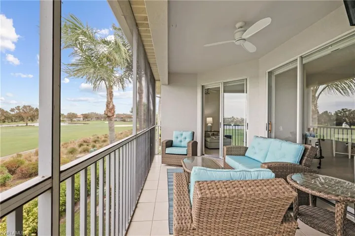 Balcony with ceiling fan and an outdoor living space