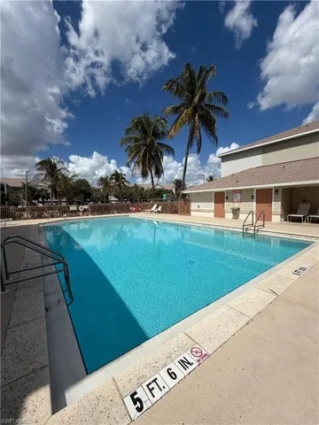 Community pool featuring a patio