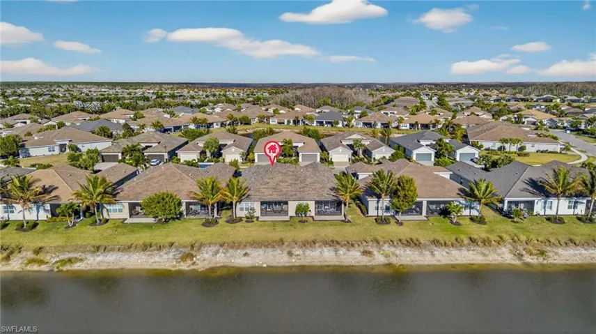 Aerial view featuring a nearby body of water