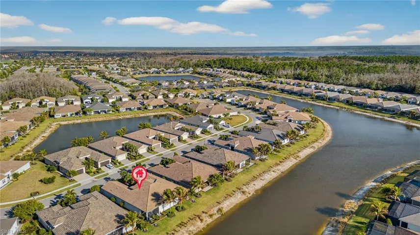 Aerial view of residential area with a nearby body of water