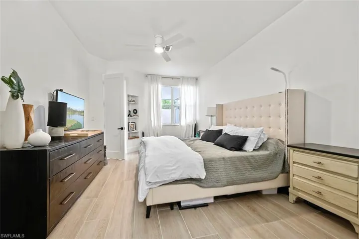 Bedroom featuring light wood-style floors and ceiling fan