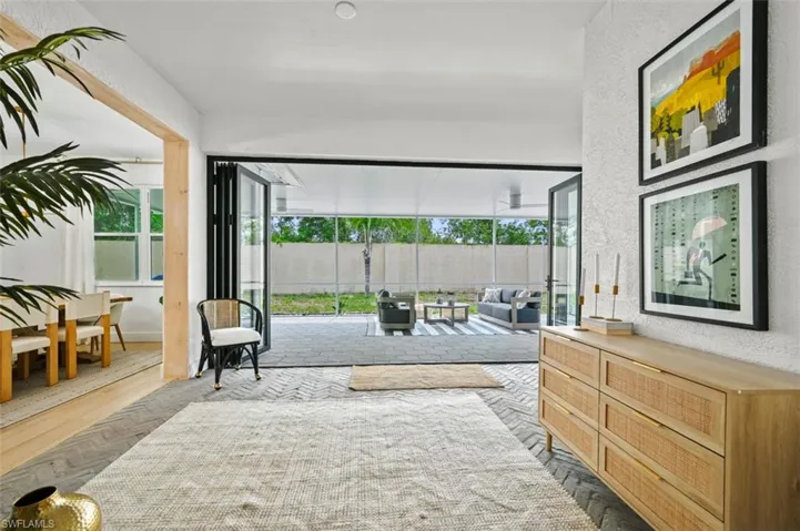 Living area with plenty of natural light and a textured wall