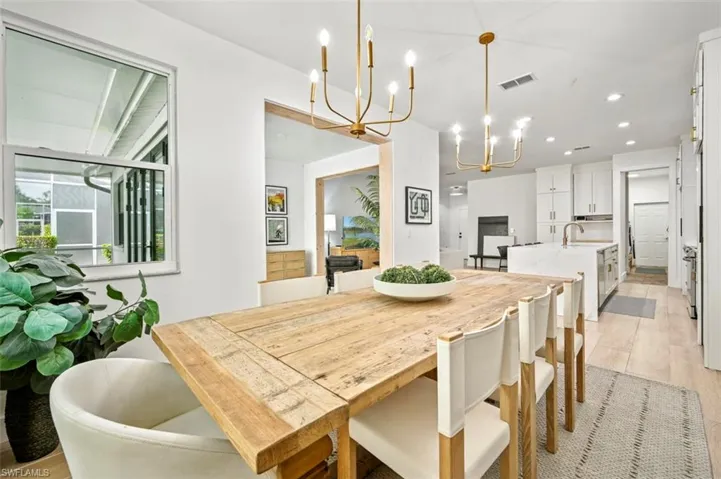 Dining room featuring a chandelier and recessed lighting