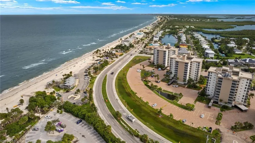 Bird's eye view featuring a water view and a view of the beach