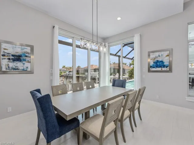Dining space featuring a water view, plenty of natural light, and recessed lighting