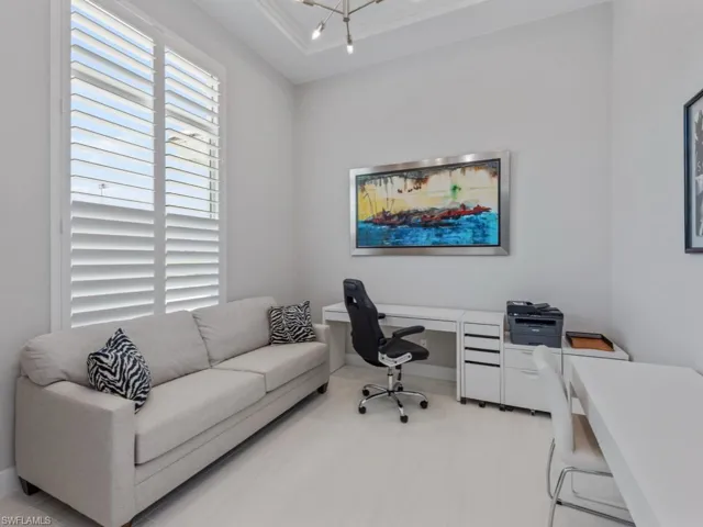 Office with ornamental molding and rail lighting