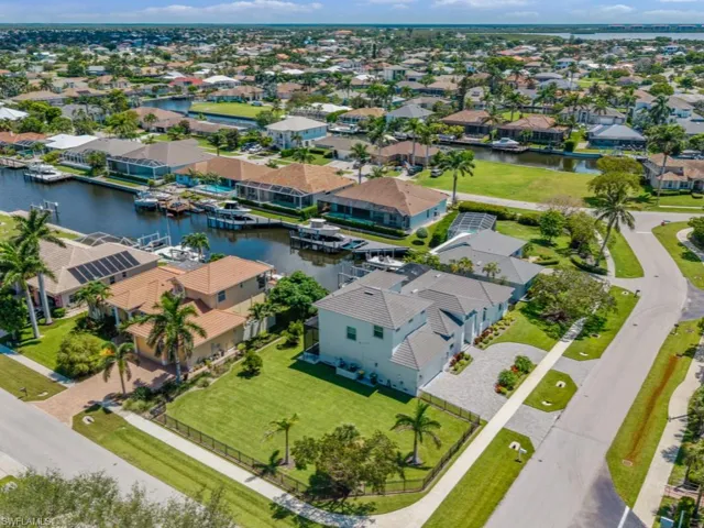Aerial perspective of suburban area with a large body of water