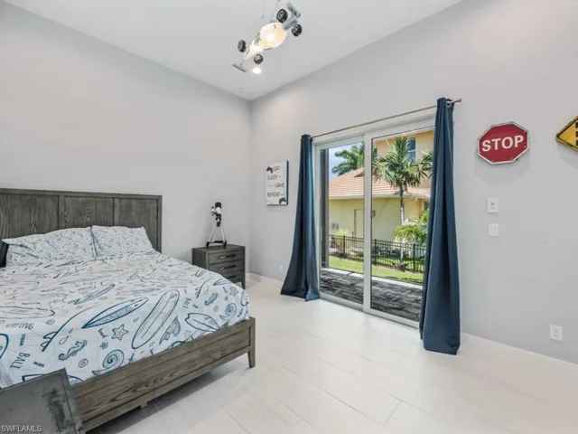 Bedroom with access to exterior and recessed lighting