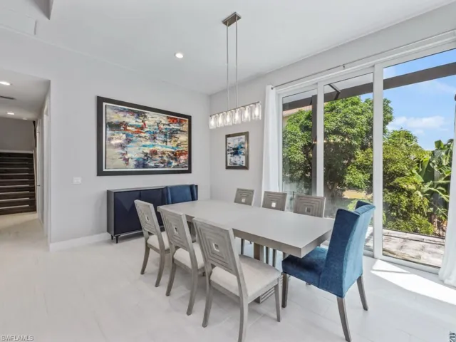 Dining room featuring stairway and recessed lighting