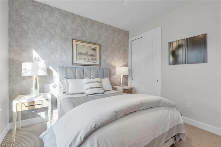 Bedroom featuring a closet and light colored carpet