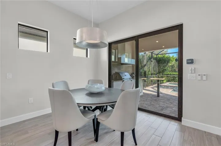 Dining space with light hardwood / wood-style flooring