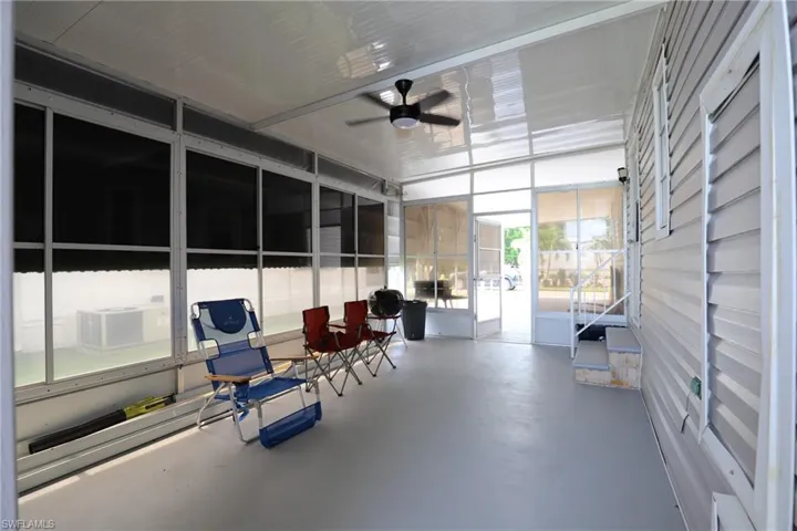 Sunroom / solarium featuring ceiling fan