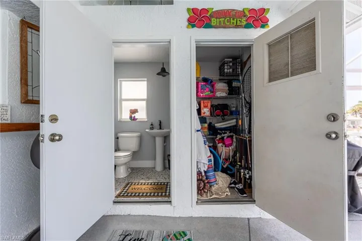 Bathroom with tile patterned flooring and a storage closet