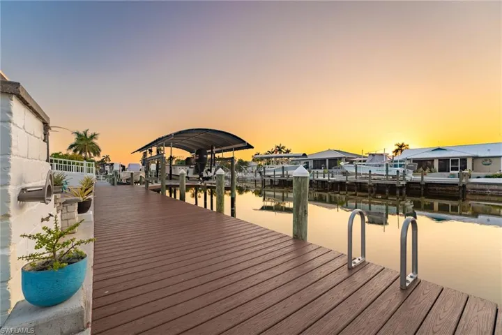 Dock with a water view and boat lift