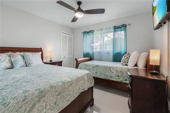 Bedroom featuring ceramic tile flooring and light gray walls