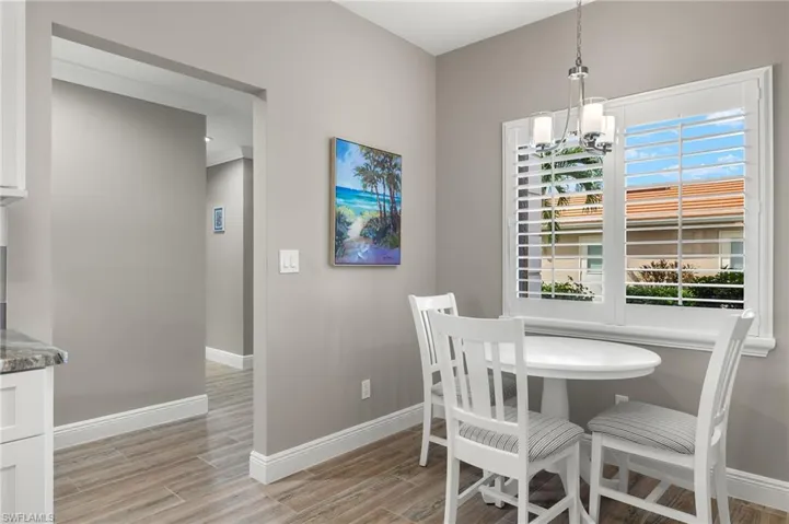 Dining area featuring a chandelier and light hardwood / wood-style floors