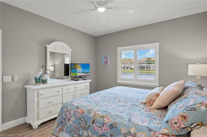 Bedroom featuring ceiling fan and light hardwood / wood-style floors