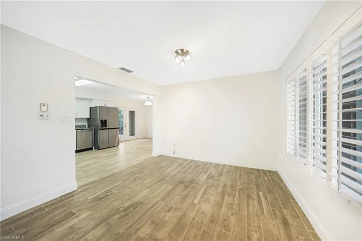 Unfurnished living room with light wood-type flooring