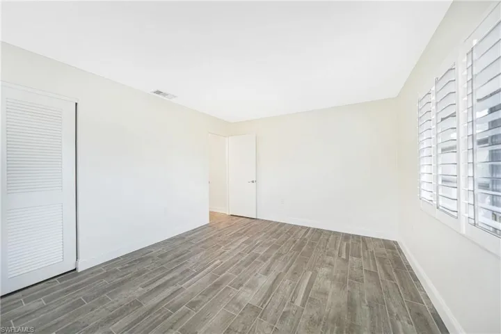 Spare room with hardwood / wood-style flooring