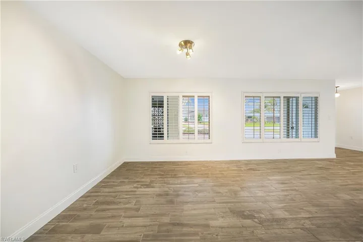 Empty room featuring hardwood / wood-style floors