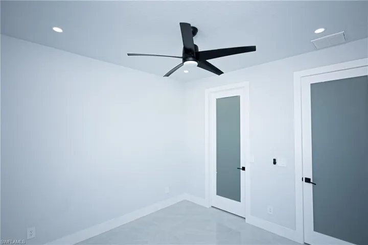 Unfurnished bedroom with baseboards, a ceiling fan, visible vents, and recessed lighting