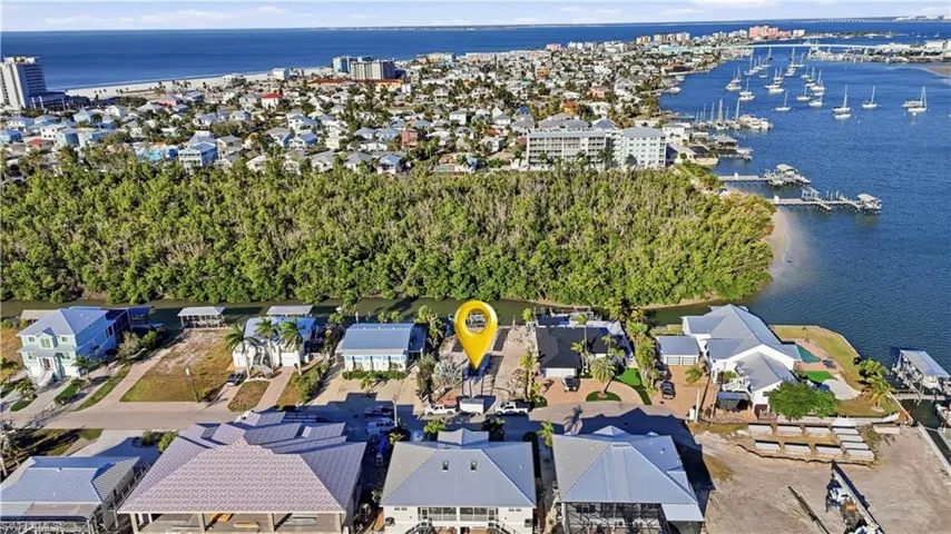 Aerial view of property's location with a nearby body of water - Virtually Edited Image