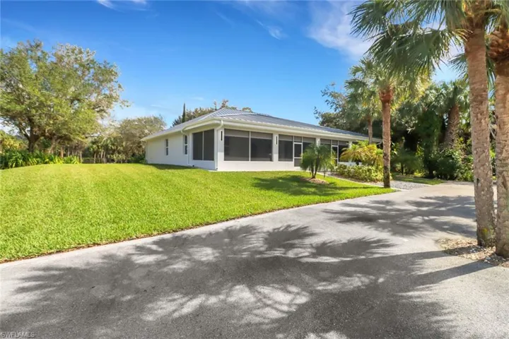 Back of property with a yard