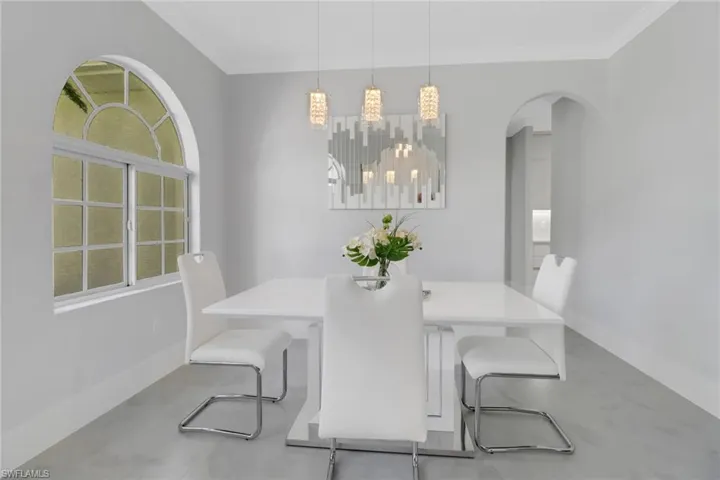 Dining space featuring ornamental molding