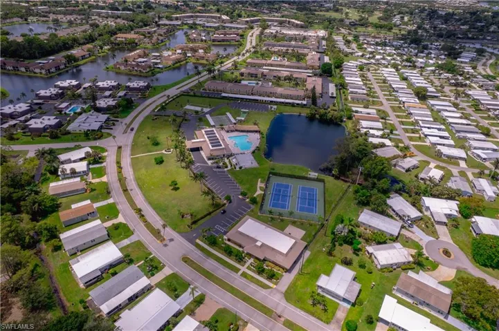 Aerial overview of property's location with a large body of water and nearby suburban area