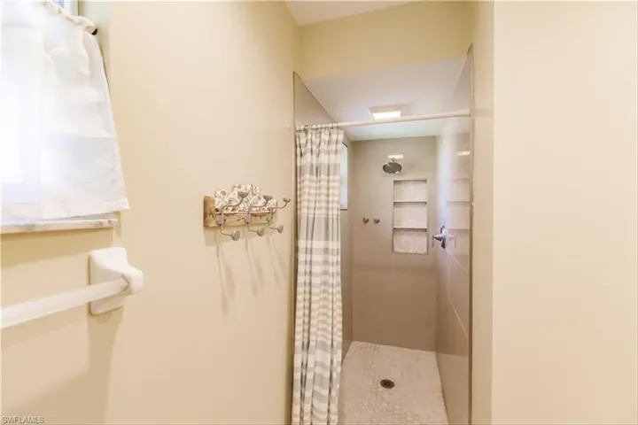 Bathroom with a shower with curtain