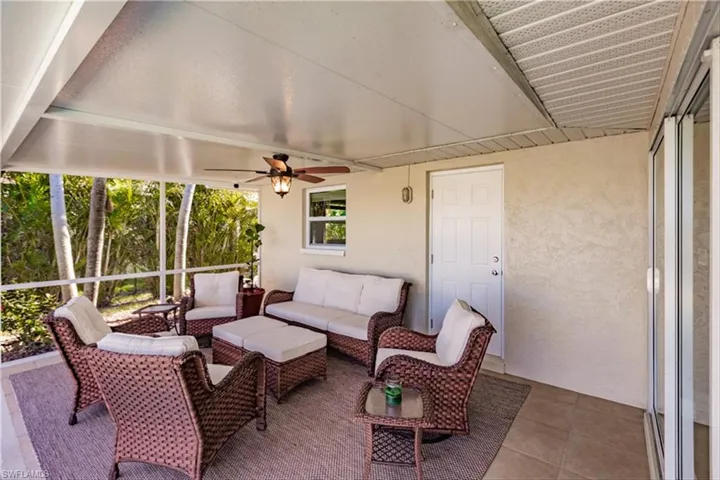 Sunroom with ceiling fan and plenty of natural light