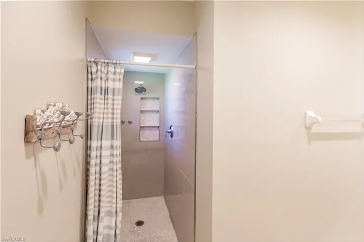 Bathroom featuring walk in shower