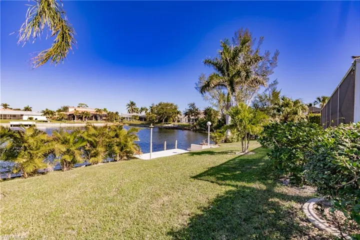 View of yard with a water view