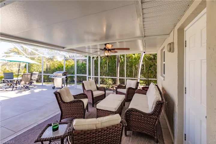 View of patio / terrace featuring a lanai, a grill, and an outdoor hangout area
