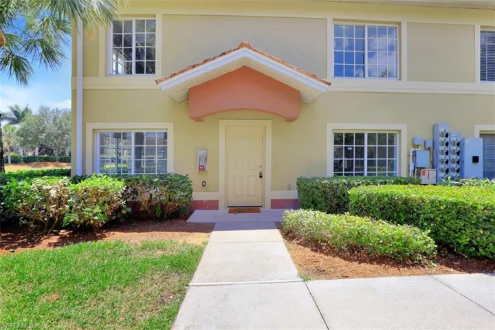 Property entrance with stucco siding