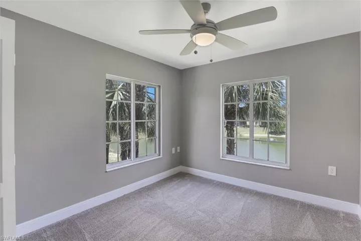 Spare room with baseboards, carpet floors, and a healthy amount of sunlight