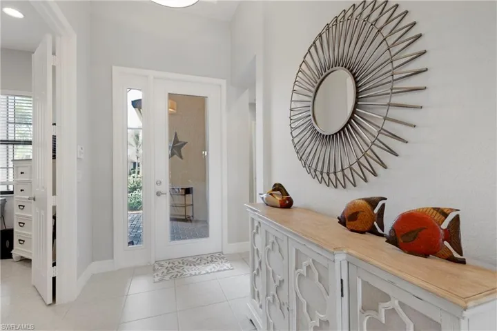 Entryway featuring light tile patterned flooring