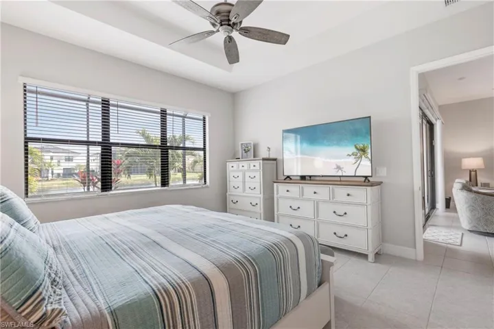 Tiled bedroom with ceiling fan
