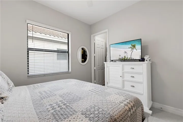 Tiled bedroom with ceiling fan