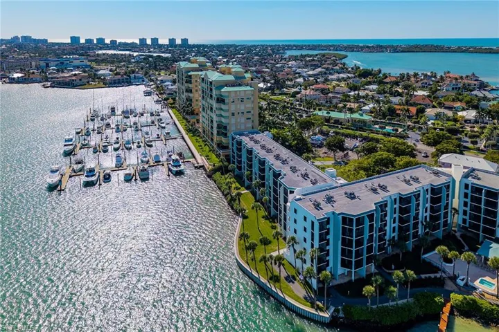 View of urban area featuring a nearby body of water and apartment complex / building