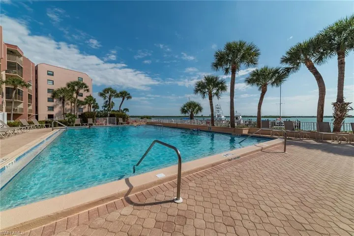 Community pool featuring a patio