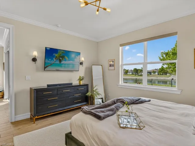 Spacious primary suite with tranquil lake views.