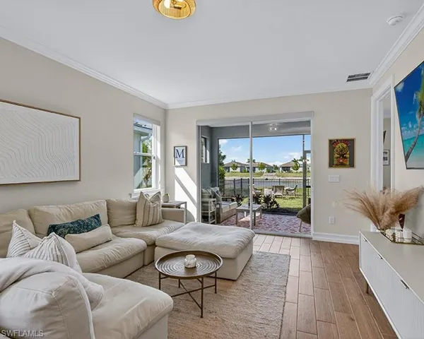 Open living area with sliding doors leading to the covered lanai.